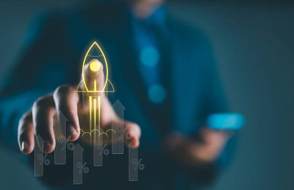 Businessman touch on icons about business and investment, Rocket launch with arrow up percentage, Wealth fast, Graph depicting rising earning, increasing profits exemplifies financial success.
